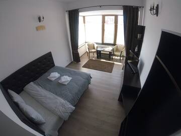 Фото номера Люкс с 1 спальней и балконом Проживание в семье Cochet Accommodation г. Пьятра-Нямц 4