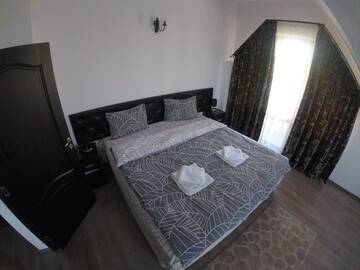 Фото номера Люкс с 1 спальней и балконом Проживание в семье Cochet Accommodation г. Пьятра-Нямц 5